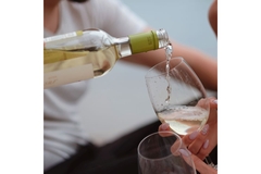 Pourring wine in glass.